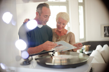 Older couple listening to vinyl records
