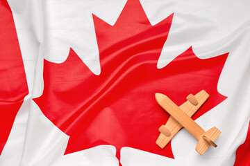 Wooden airplane on flag of Canada