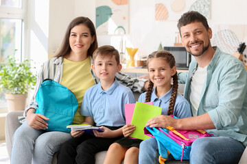 Parents getting their little children ready for school