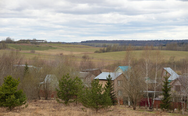 Panorama of Klin-Dmitrovsky ridge with villages in early spring, Sergiev Posad district, Moscow  region, Russia