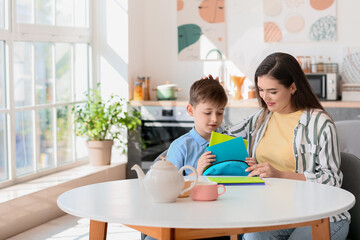 Mother getting her little boy ready for school