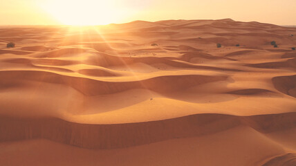Fototapeta na wymiar AERIAL. Top view of huge desert at the sunset or sunrise in UAE.