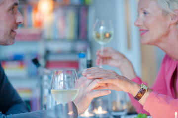 Close up of romantic older couple holding hands