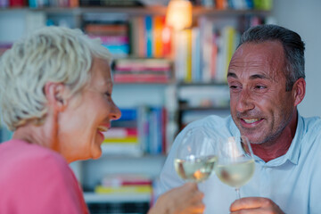 Older friends drinking white wine