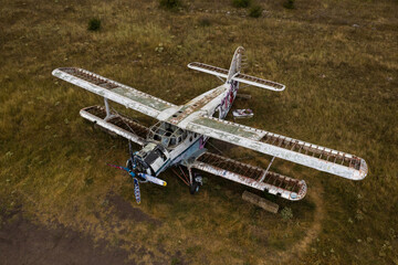 Old abandoned airplane in the field