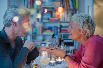 Close up of romantic older couple holding hands