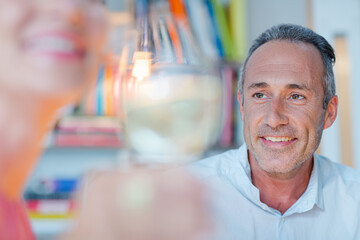 Older man smiling at wife