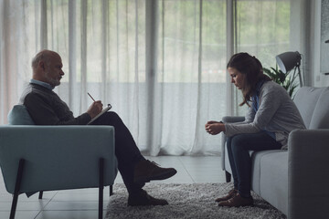 Therapist and patient during a psychotherapy session - obrazy, fototapety, plakaty