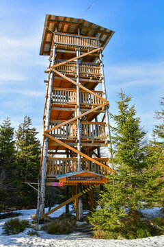 A wooden lookout tower on top of the Czernica Mountain in the Sudetes, winter day.