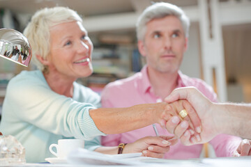 Business people shaking hands in meeting