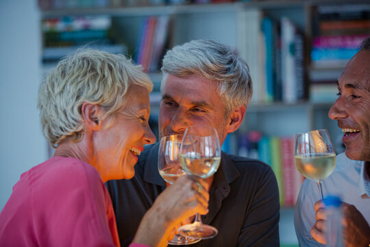 Older Friends Tasting White Wine