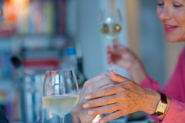 Close up of romantic older couple holding hands