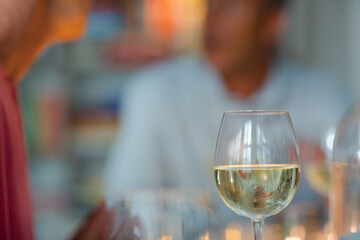 Older romantic couple drinking white wine