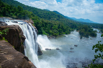 Fototapeta na wymiar Athirapally waterfalls Kerala India, Beautiful waterfall Landscape photography Athirapally Kerala India, beautiful waterfall in rain forest