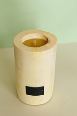 Wooden candle holder rustic interior centerpiece with candles in a cozy barn setting.