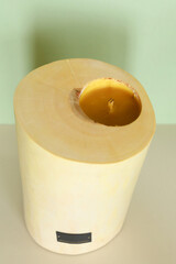 Wooden candle holder rustic interior centerpiece with candles in a cozy barn setting.