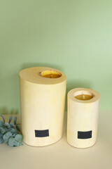 Wooden candle holder rustic interior centerpiece with candles in a cozy barn setting.