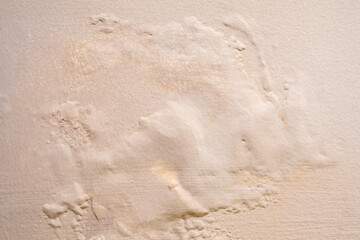 Brown wall damp damaged with peeling paint