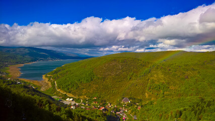 Landscape of Mavrovo national park with rainbow, mountain and lake, FYR Macedonia - obrazy, fototapety, plakaty