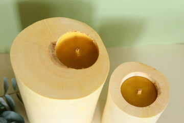 Wooden candle holder rustic interior centerpiece with candles in a cozy barn setting.