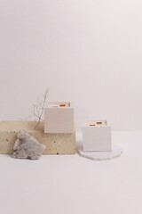 scented candles on off white background in rock holder