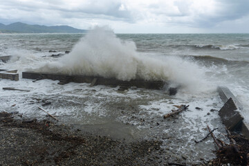 storm on the black sea, waves crashing on the shore, brown water