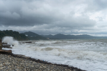 storm on the black sea, waves crashing on the shore, brown water