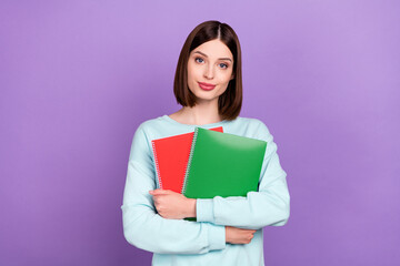 Photo portrait girl keeping book preparing to test isolated pastel purple color background