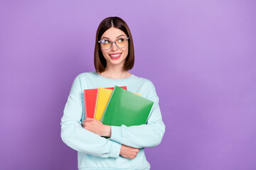 Photo portrait girl keeping book looking copyspace wearing glasses isolated pastel purple color background