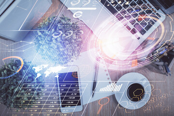 Double exposure of technology theme drawing over work table desktop. Top view. Global data analysis concept.