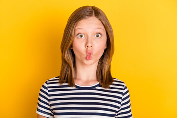 Portrait of carefree positive pupil lips make fish face have fun look camera isolated on yellow color background