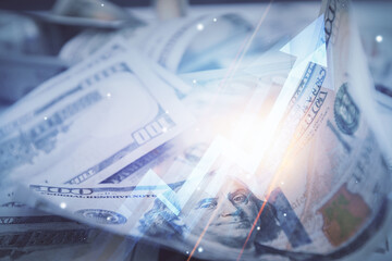 Double exposure of grow arrows drawing over usa dollars bill background. Concept of success.