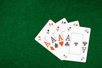 poker game. four aces on green table