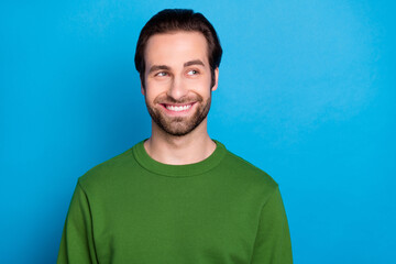 Portrait of glad candid person toothy smile look interested empty space isolated on blue color background