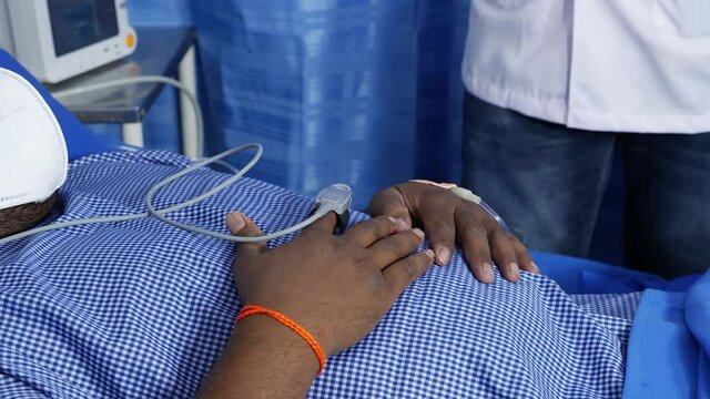 View of attaching oxymeter wire to finger of patient