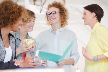Fototapeta premium Portrait of female colleagues smiling in office