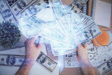 Multi exposure of brain drawing hologram and us dollars bills and man hands. Ai invest concept