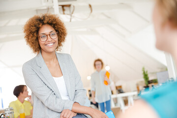 Obraz premium Woman walking and carrying laptop, joining colleague from office