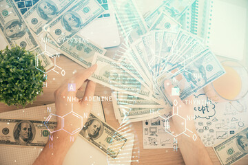 Multi exposure of dna drawing hologram and USA dollars bills and man hands. Medical education concept.
