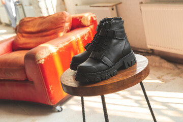 Women footwear on wooden stand, modern style and photo in vintage studio background
