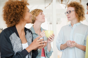 Women with coffe cup smiling in office