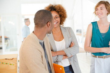 Portrait of talking and smiling office workers