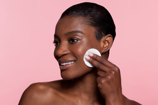 Young Woman Using Cotton Pad