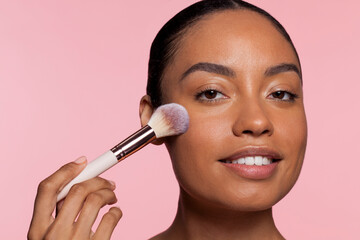 Woman using make-up brush