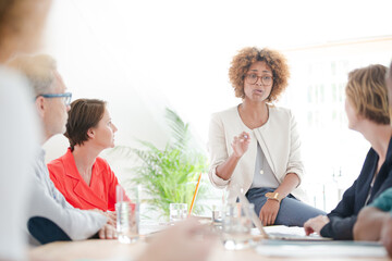 Office workers talking at desk