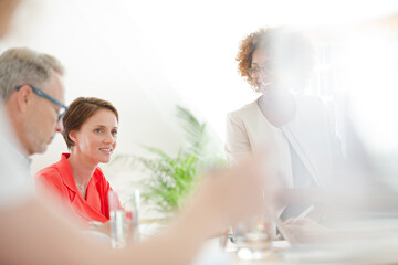 Office workers talking at desk
