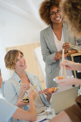 Office workers having lunch together