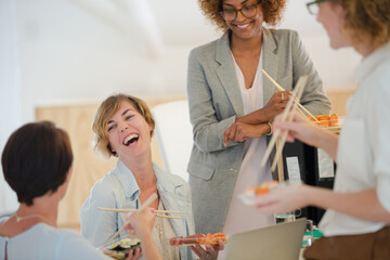 Office workers having lunch together