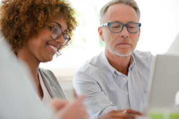 Fototapeta premium Office workers talking at meeting