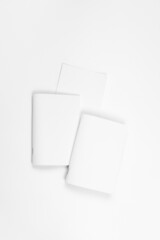 Mock up of notebook. Blank sheets of paper for brochure or notebook on white isolated background, top view. 